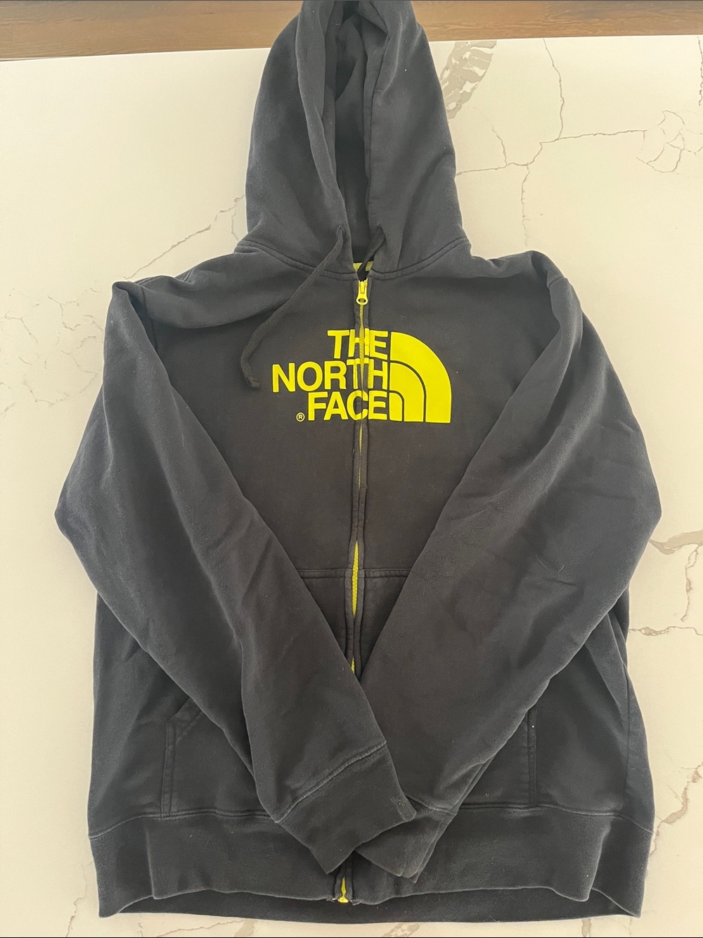 The North Face Black Hoodie with Yellow Logo Accents